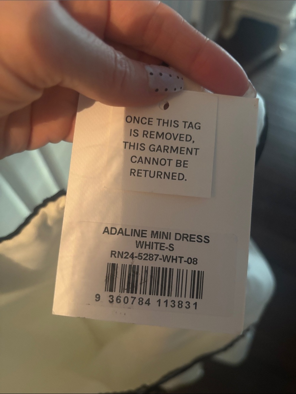 Sleeveless White Mini Dress with Black Trim - Picture 11 of 12